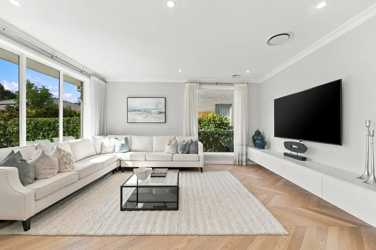 White living room with herringbone floor