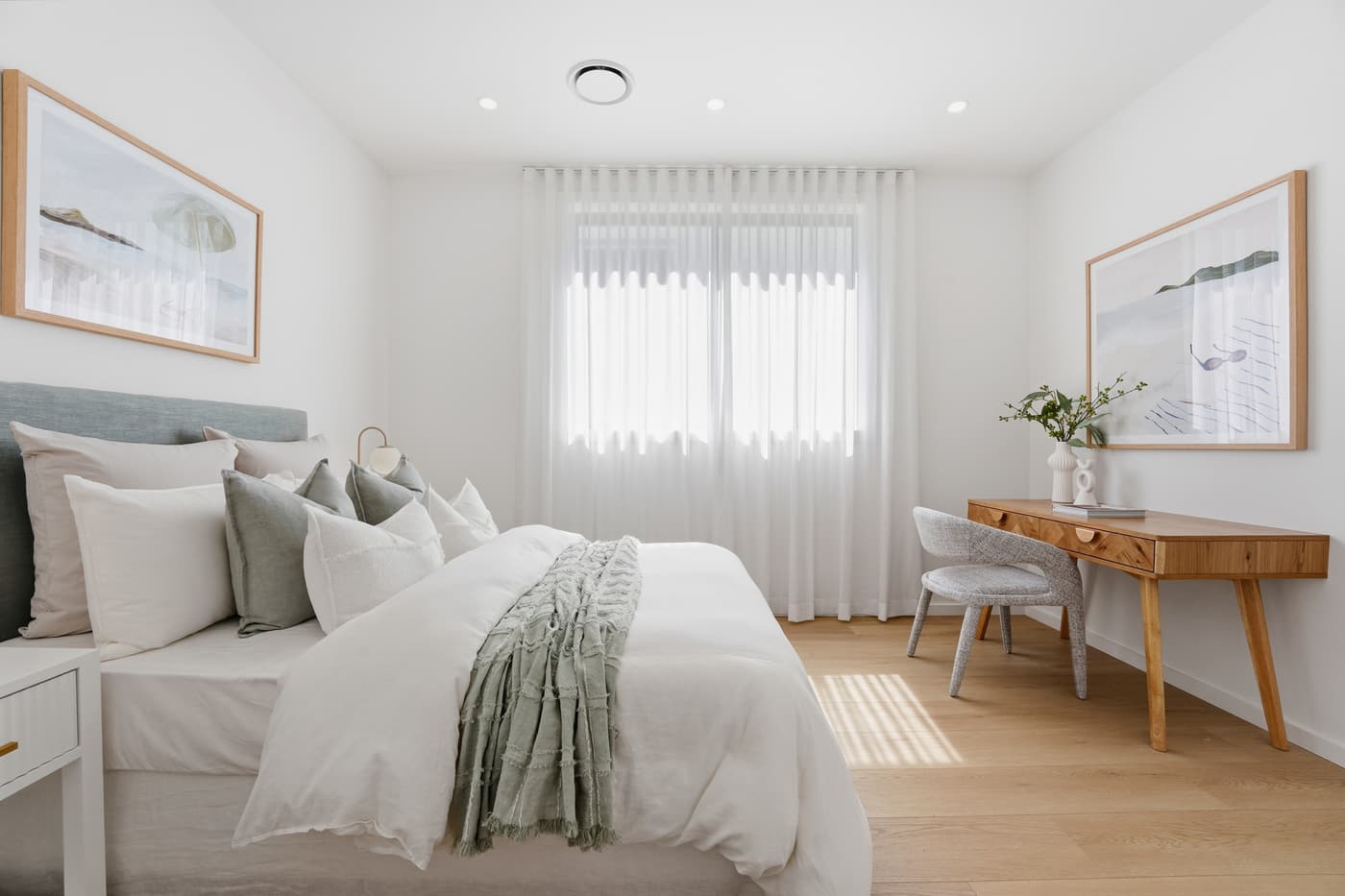 Main bedroom styled in soft neutrals